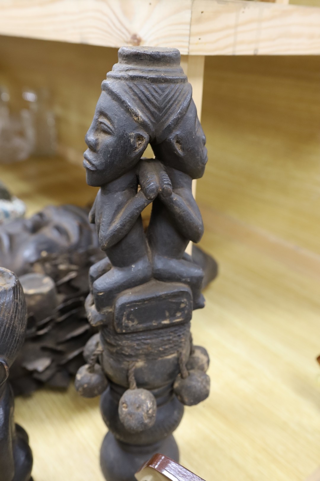 A group of Democratic Republic of Congo tribal carved wood figures and instrument and a Kuba style beadwork and shell mount mask